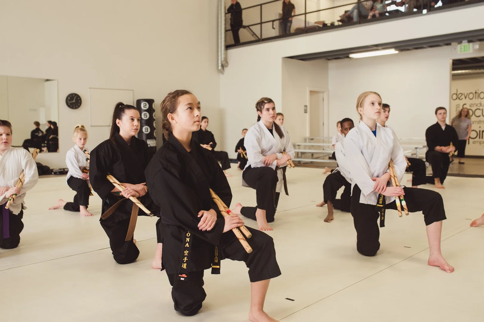 New adult karate students in uniform at Kona Karate