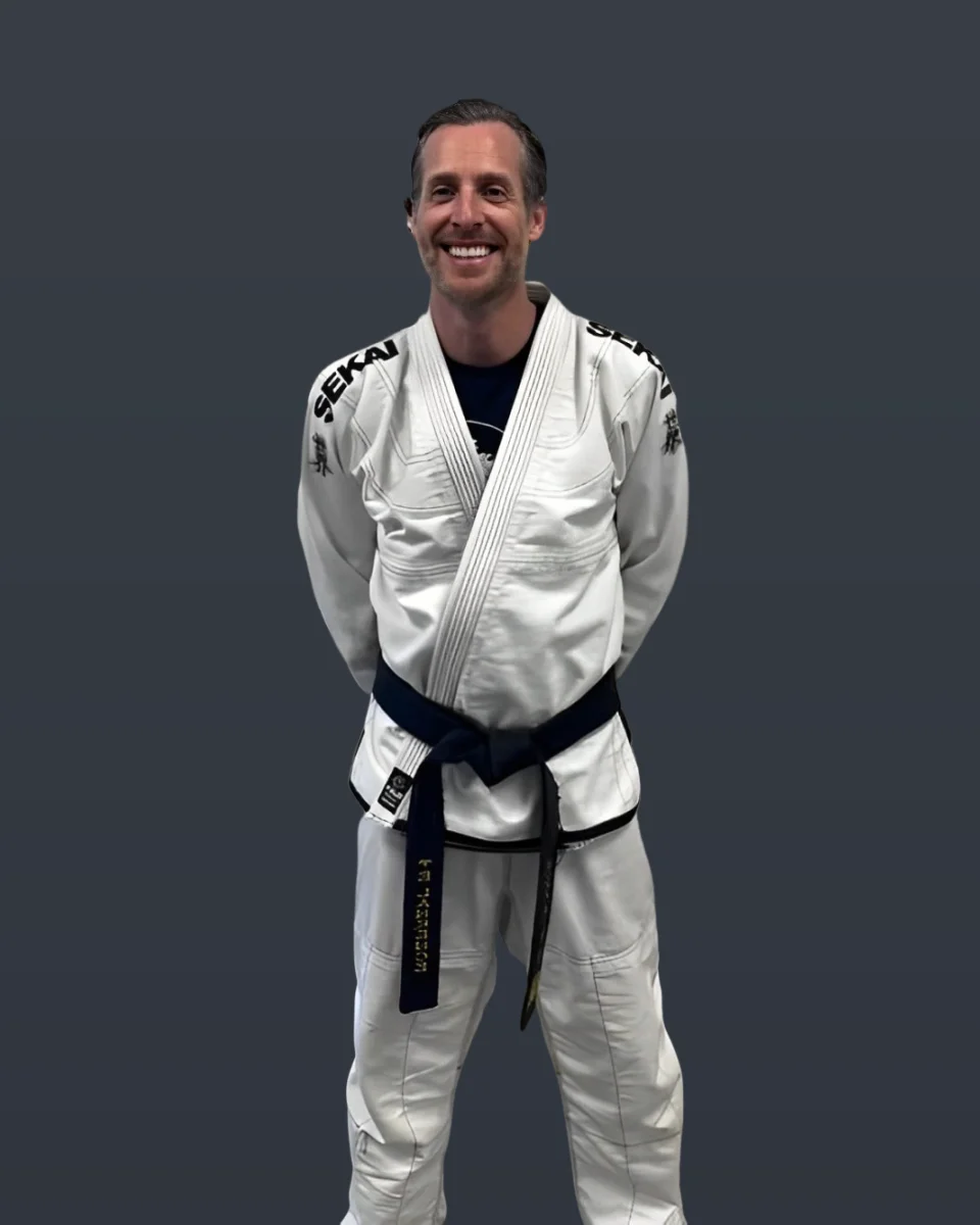 A adult karate student celebrating a breakthrough moment at Kona Karate